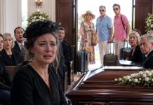 I buried my husband and our six-year-old daughter alone while my parents and brother raised champagne glasses on a sunny beach, claiming their vacation “couldn’t be canceled for a funeral.” At the cemetery, my phone buzzed with a photo of them laughing. “Family comes first,” my mother captioned it. I wiped my tears, opened the sealed envelope my husband had left behind, and whispered, “You’re about to learn what family really costs.”