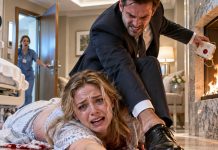 I was bleeding out on the delivery-room floor when I reached for my phone—until Ethan slammed his shoe onto my wrist. Crack. I screamed. “Your brother’s bloodline ends tonight, Hannah,” he snarled. “And that baby will never touch our family trust.” Then he ripped the emergency button from the wall and threw it into the fire. He thought no one was coming. But seconds later, the locked door began to open…