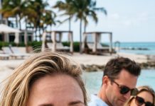 I froze when I saw my husband holding a bikini model tightly on the beach—the same arms that had held me for five years. “Who is she?” I demanded. He didn’t explain. Instead, his palm slammed across my face. “Know your place,” he whispered. My cheek burned as strangers stared. But what he didn’t know was that I had just discovered something far more shocking than his affair.