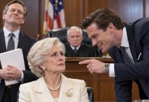 My son smiled across the courtroom and whispered, “Don’t fight this, Mom. You’ll only embarrass yourself.” He thought declaring me incompetent would hand him my eleven-million-dollar estate. Then my lawyer revealed the name I had used before marriage. The judge suddenly went pale, removed his glasses, and stared at me. “Eleanor Voss?” he whispered. My son laughed nervously. He still had no idea who his mother really was.