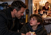 I ARRIVED EARLY TO MY BROTHER’S CHRISTMAS EVE DINNER. FOUND MY SON ON A FOLDING CHAIR IN THE GARAGE. EATING A GAS STATION SANDWICH. INSIDE, HIS COUSINS SAT AT THE DINING TABLE. MY SISTER-IN-LAW WAS SERVING THEM PRIME RIB. MY SON LOOKED UP. EYES FILLED WITH TEARS. “DAD, AUNT VICTORIA SAID I SMELL LIKE A KITCHEN.” I WALKED IN. KNOCKED OVER THE CHAMPAGNE TOWER. WHAT I SAID NEXT MADE 35 GUESTS GO SILENT…