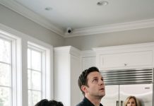 “I was three days postpartum when my husband shoved a plate toward me and snarled, ‘Eat it. Stop pretending you’re sick.’ My bruised hands trembled as our newborn screamed beside us, but he didn’t notice the tiny camera I’d hidden above the refrigerator. Then his face suddenly went white. “Who did you send that recording to?” he whispered. I wiped my tears and looked toward the front door. “Someone you should be very afraid of.”