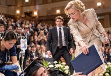 I was barely conscious on the auditorium floor when my mother-in-law stepped over my shaking body and snatched the folder from my hand. “Die quietly, you useless parasite. My son deserves better.” Then she marched onto the stage and began reading my “valedictorian speech” aloud. Her smile vanished halfway through. It wasn’t a speech—it was an immediately binding trust agreement, and every word she read tightened the legal trap around her.